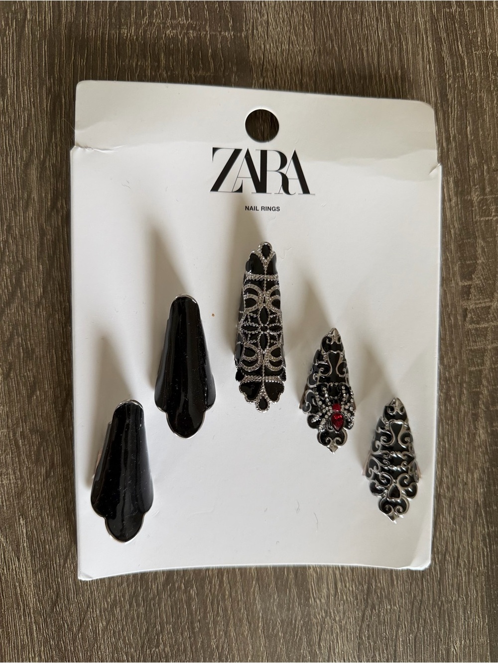 Ornate Nail Rings with Red Accent